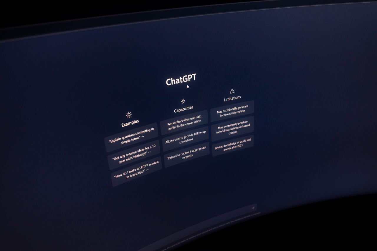 services-04 Close-up of a computer screen displaying ChatGPT interface in a dark setting.